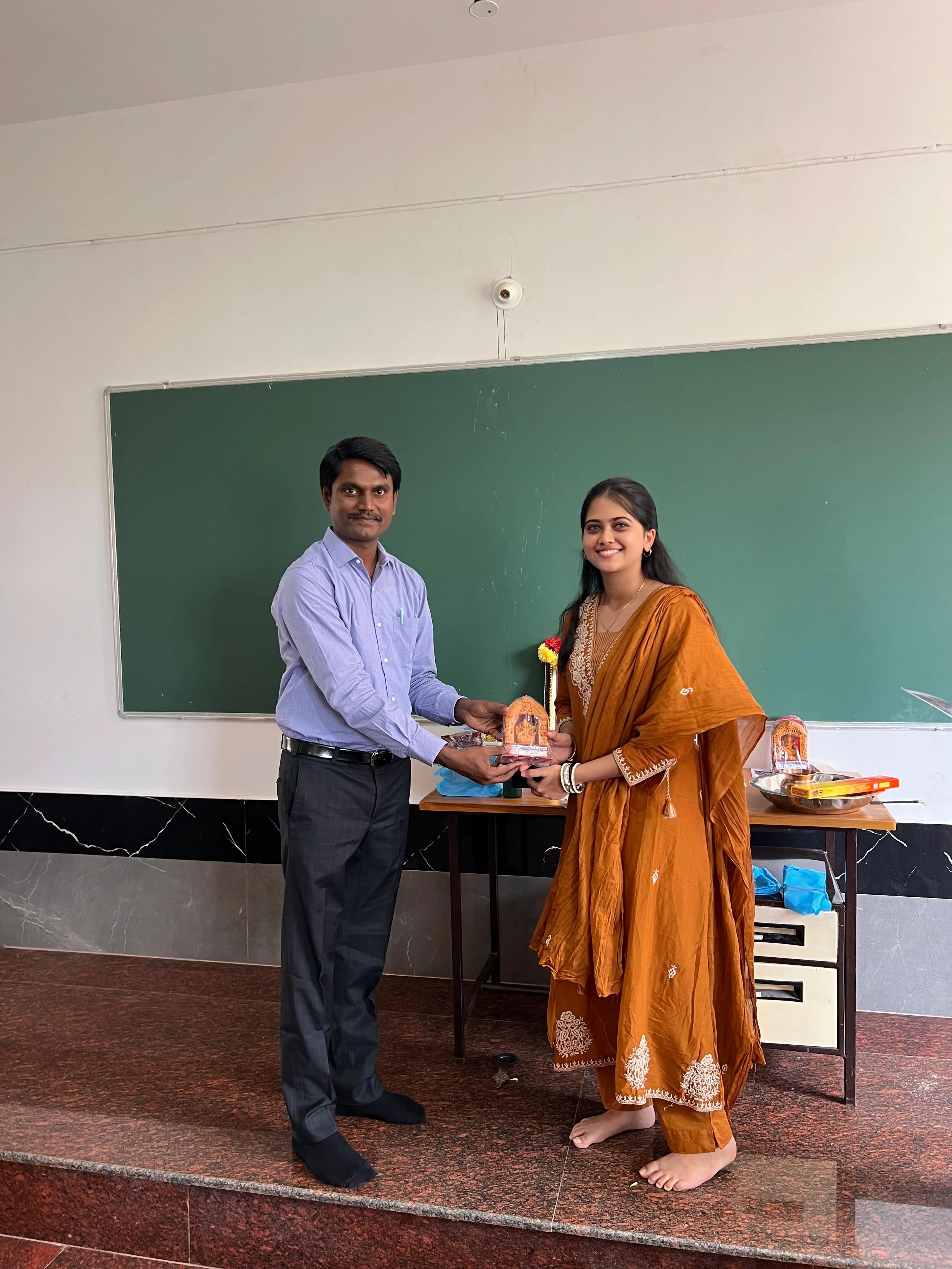 Student receiving an award from faculty at IMSC